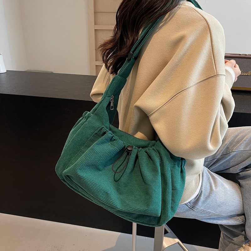 Canvas shoulder bag shown in a supplier photograph