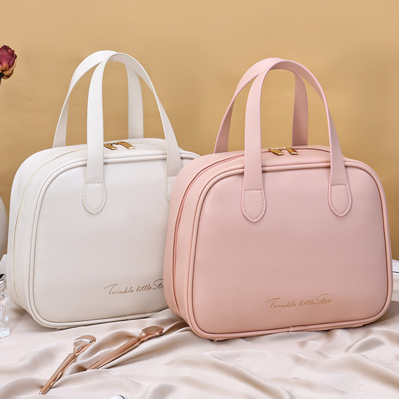 Pink and cream curved cosmetic bags with carry handles
